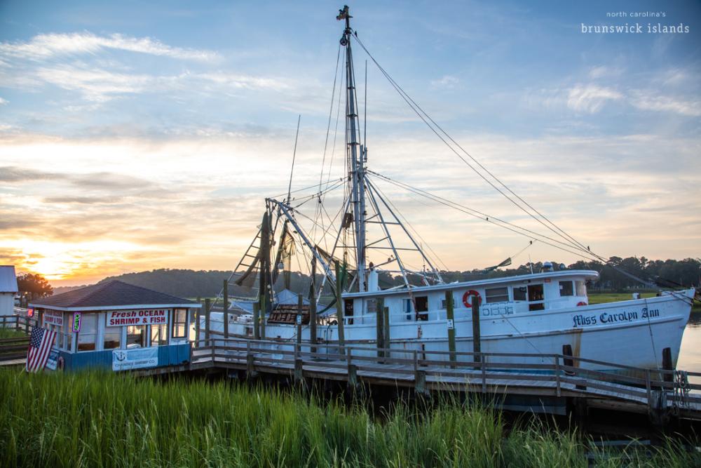 shrimp boat on a river at low light
