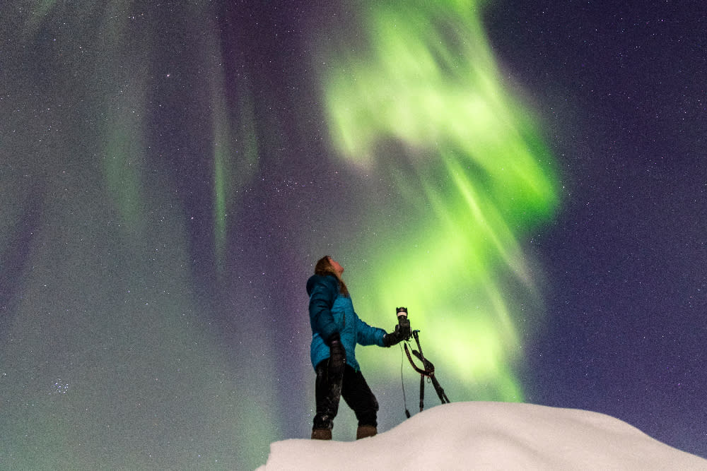 Photographer under the northern lights