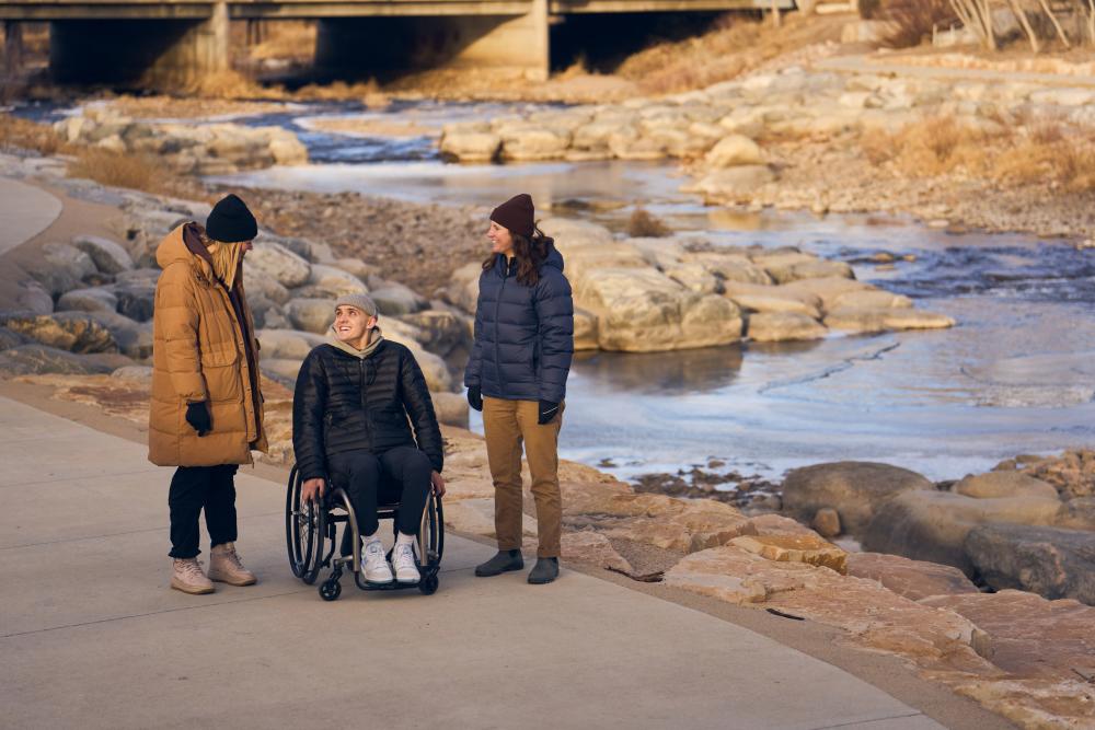Group walks along Whitewater Park in winter