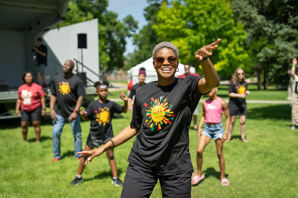 Woman dances at Juneteenth Celebration at Foothills Mall