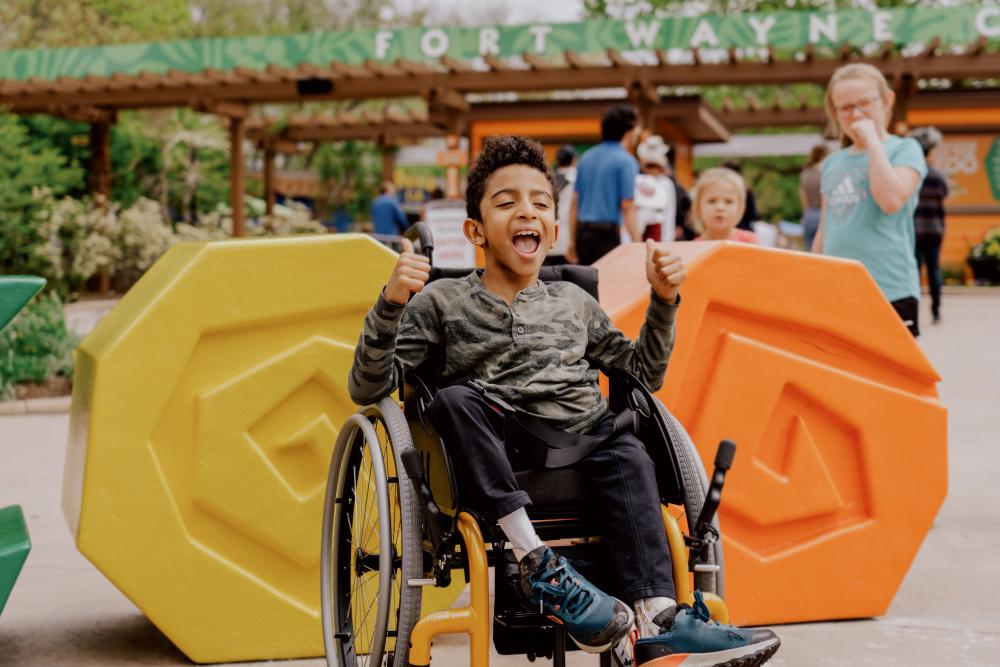 Boy in wheelchair enjoying the zoo