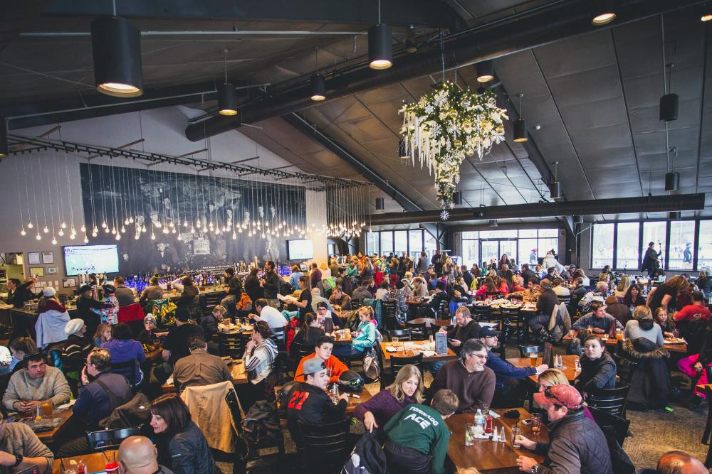 crowd dining inside Slocum Hollow Restaurant at Montage Mountain Resorts