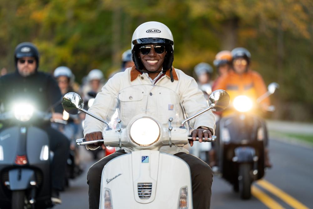 Donald Driver on scooters riding around Lake Geneva enjoying the fall scenery.