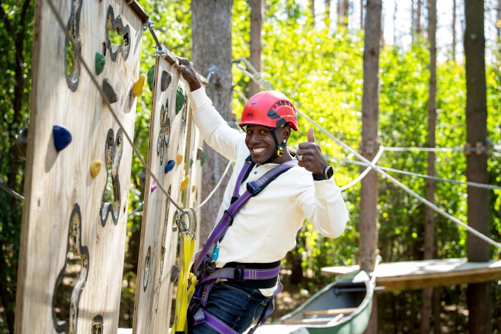 Donald Driver on the ropes course and climbing wall at the Lake Geneva Ziplines and Adventures
