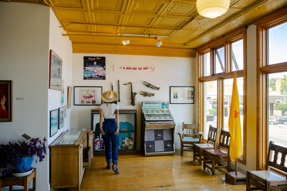 A woman looks at historic artifacts in Raton, New Mexico