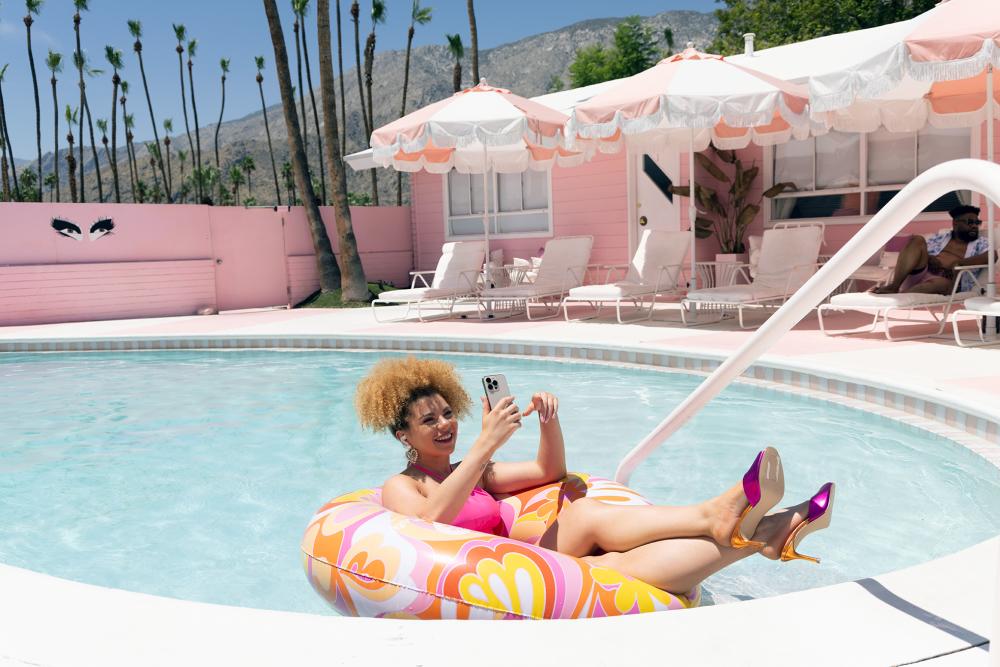 Woman in pool at Trixie Motel in Palm Springs