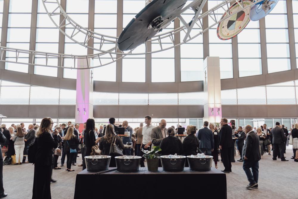 Delegates attend a reception on the second floor in the east lobby of the SAFE Credit Union Convention Center.