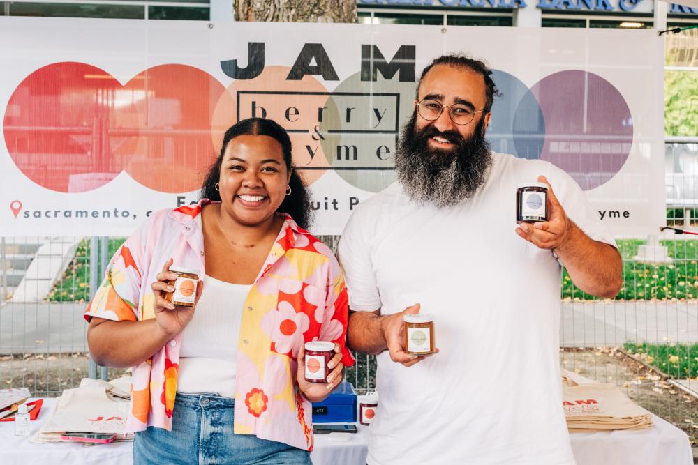 Berry & Thyme at the Farm-to-Fork Festival holding their jams