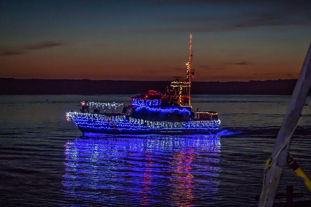 Morro Bay Lighted Boat cruising through water