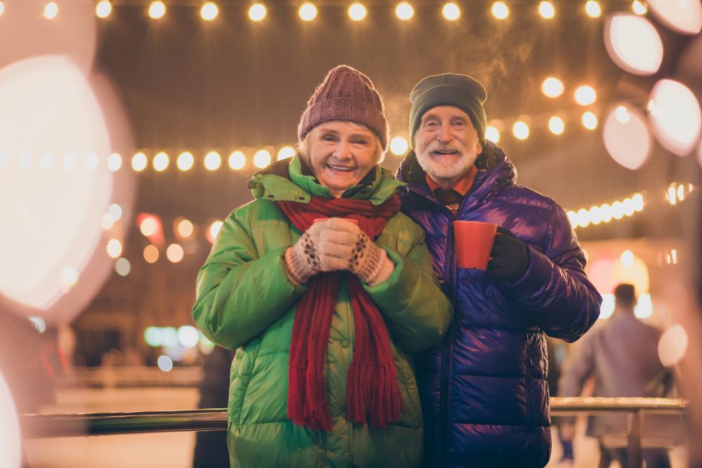 Older couple holding hot chocolate