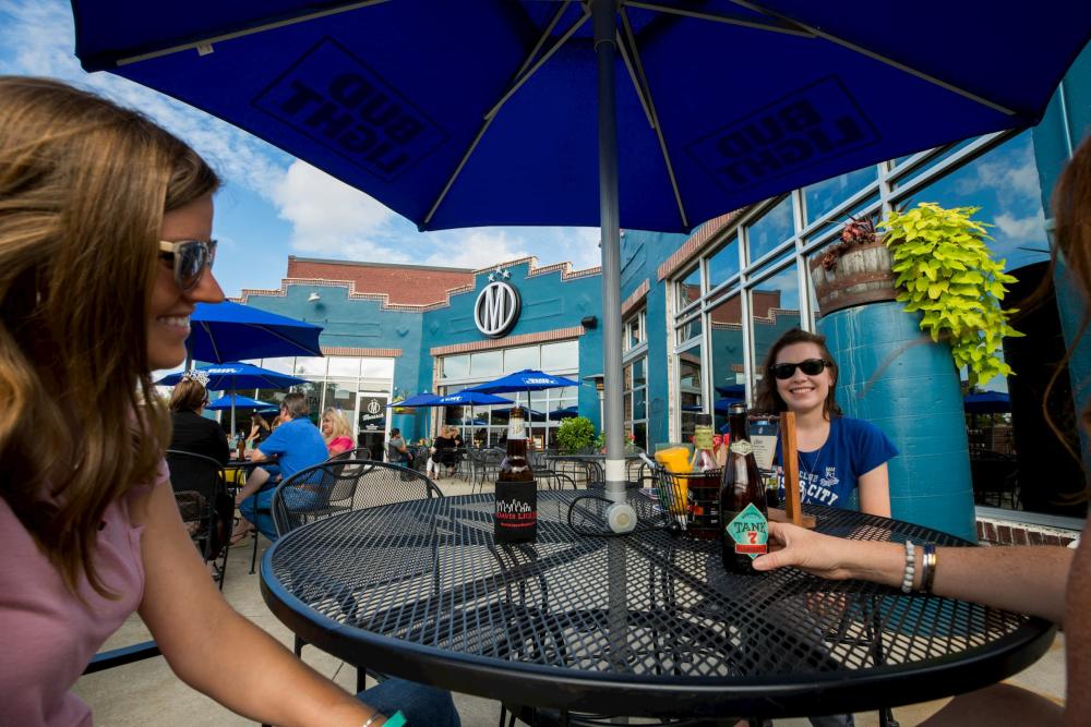 Wichita visitors enjoying drinks on a restaurant patio