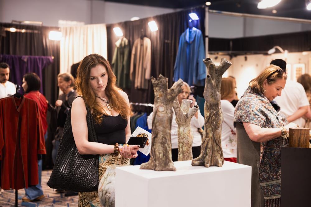 Guests browse original art and design at The Woodlands Fine Craft, Art & Design Show.
