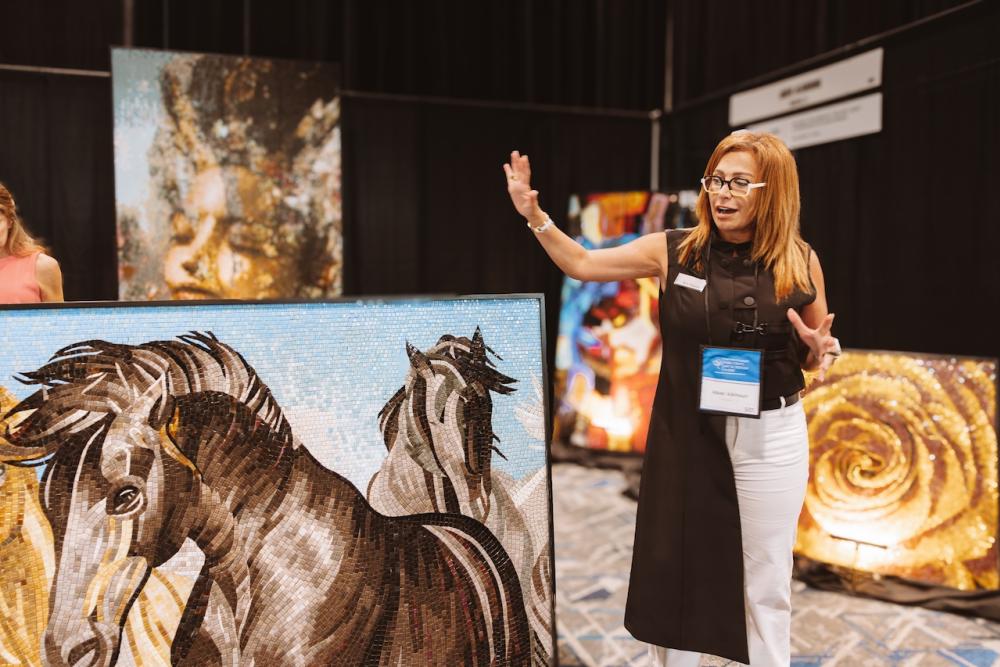 Designer Abier Al-Khouri presents her work during an artist booth talk at The Woodlands Fine Craft, Art & Design Show.
