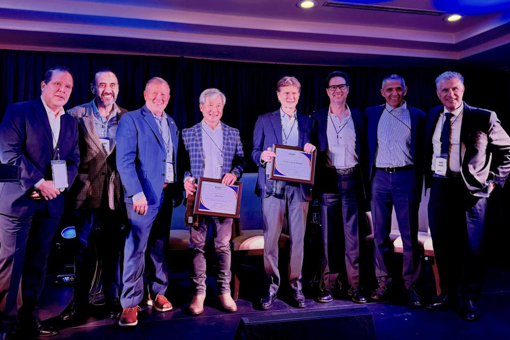 Nick Wolda stands with John Min, Enrique de la Madrid, and other PASMAA members during the PASMAA Magisterial Session at Carlton Woods in The Woodlands, TX.