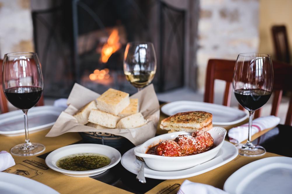 Appetizer with bread and wine at Trattoria Lisina in Driftwood TX