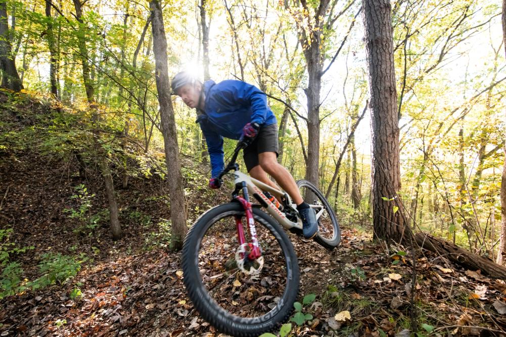 Man mountain biking in the woods around Lake Geneva