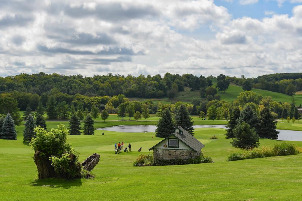 Family playing Hawk's View Golf Course