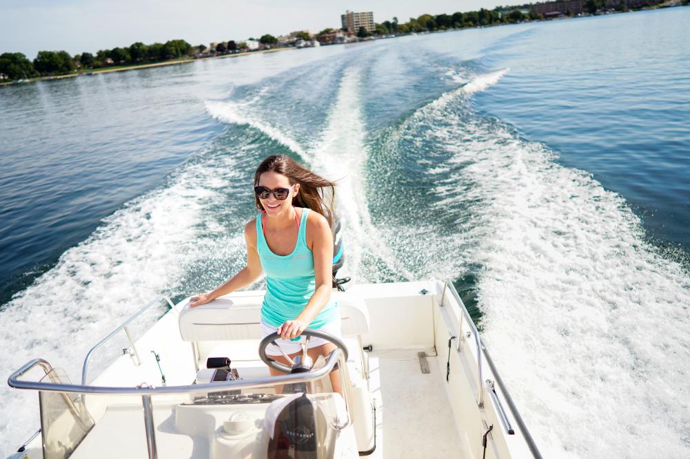 Woman driving a boat on Geneva Lake