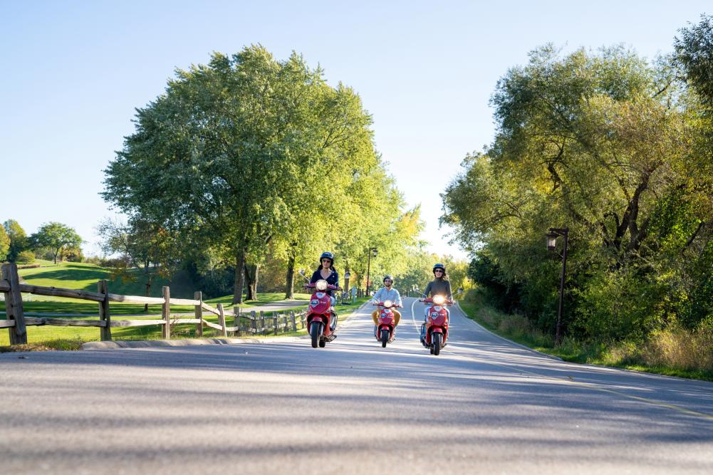 Group on scooters touring the Lake Geneva area.
