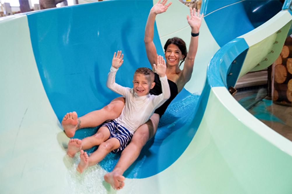 Mother & child on water slide at Timber Ridge