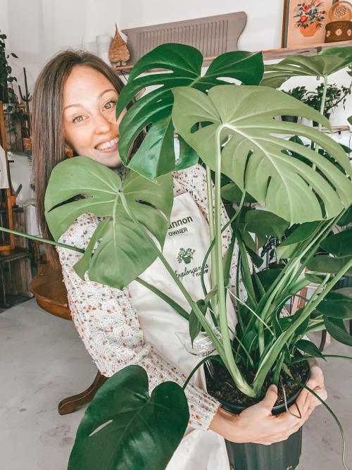 Explorganics Owner Holding a Plant