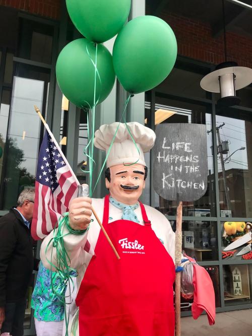 Chef statue with red apron