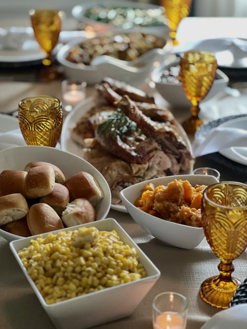 layout of thanksgiving food, rolls, turkey, sweet potatoes