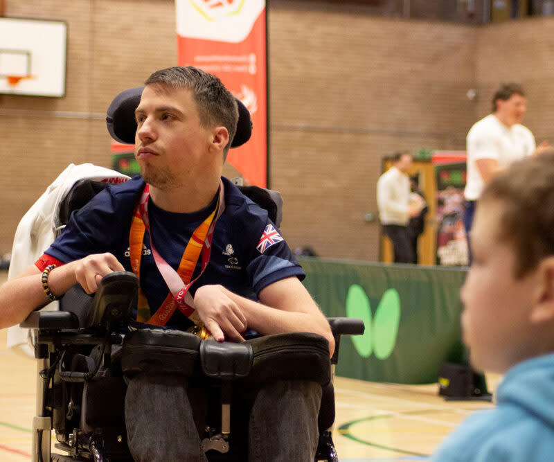 A man in an electric wheelchair taking part in sports