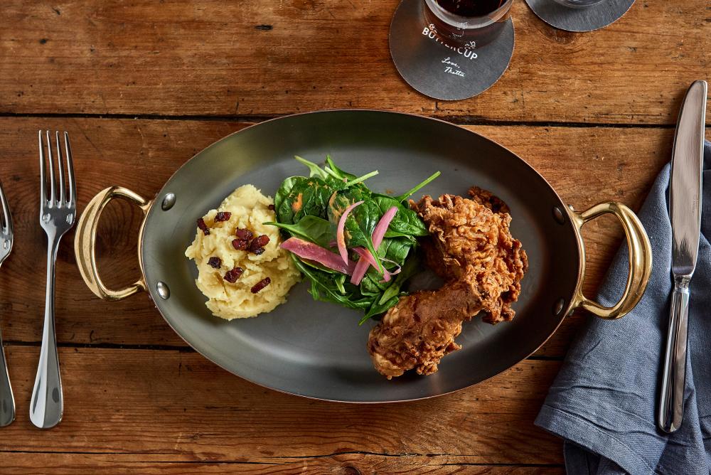 Dish with mashed potatoes and spinach and fried chicken