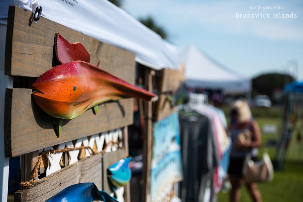 a colorful fish on a wooden board