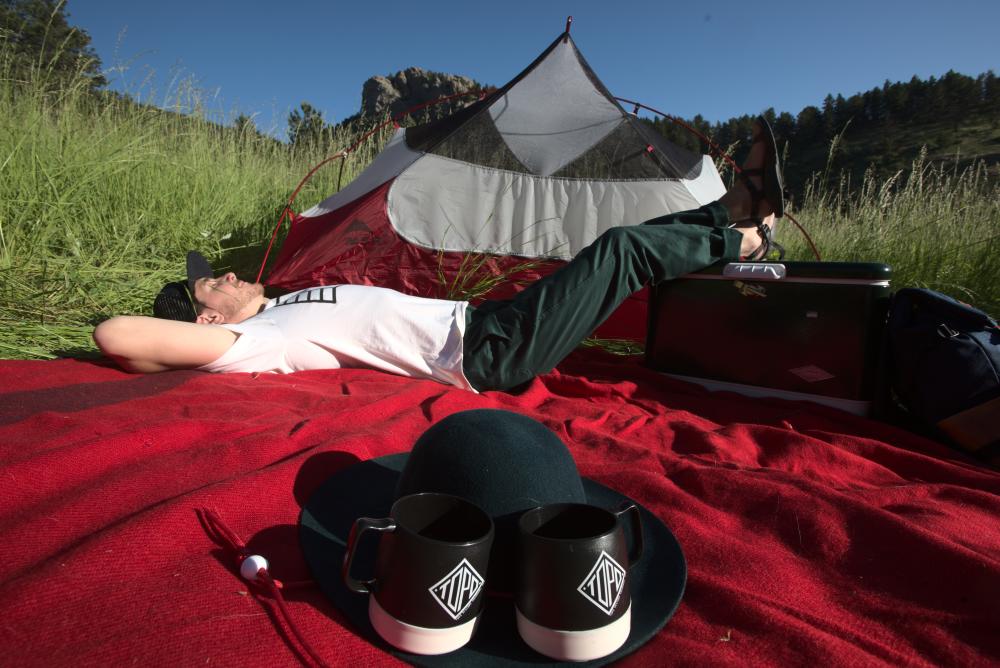 Man Camping and looking at the sky