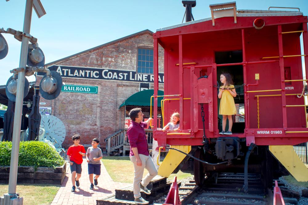 Kids playing on caboose at Railroad Museum
