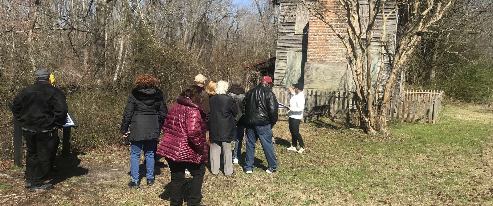 Visitors outside the Superintendent's House on the Dismal Swamp Canal in Chesapeake, VA