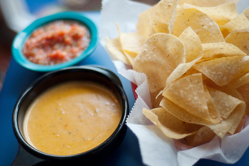 Chips, salsa, and queso at Chuy's Tex-Mex Inside on a table