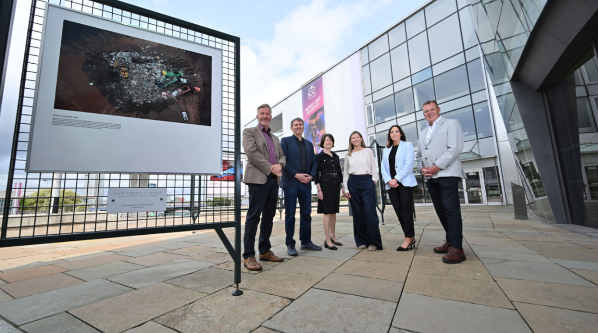 People standing outside the ICC Belfast. For Our Fragile Space Exhibition.
