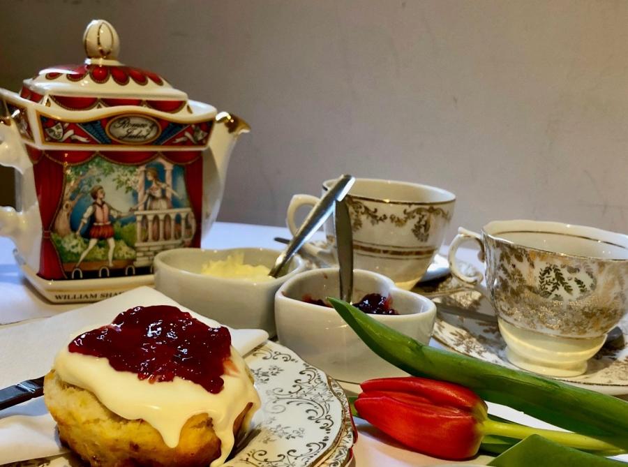 Antique teapot and crockery serving delicious afternoon tea at Diversitea Cafe