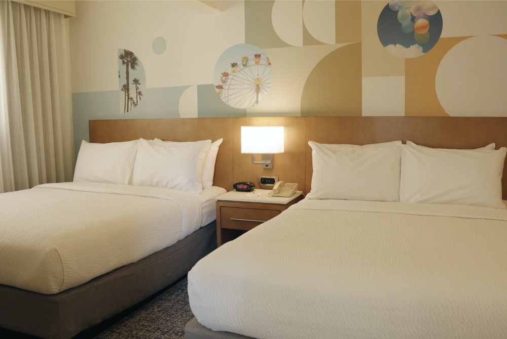 Image of two queen beds at Clementine Hotel & Suites