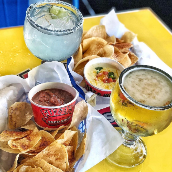 Chips with salsa, queso, and margaritas at Fuzzy's Tacos in Irving, TX