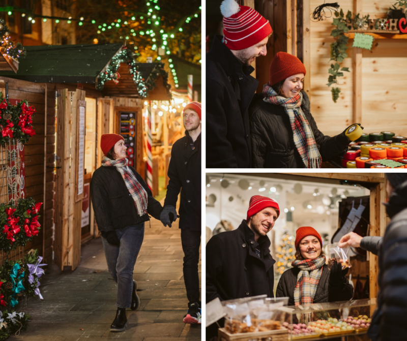 A couple walking around Swansea Christmas Market