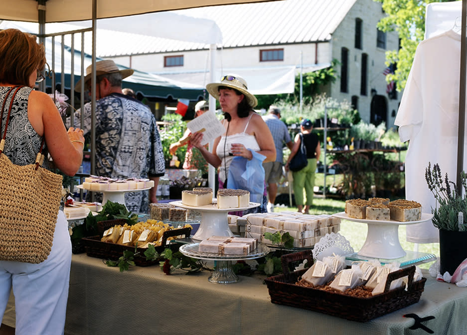 Women talking at booth during Blanco Lavender Festival