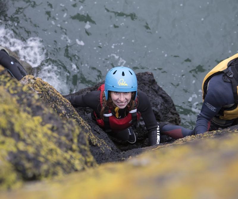 A woman coasteering