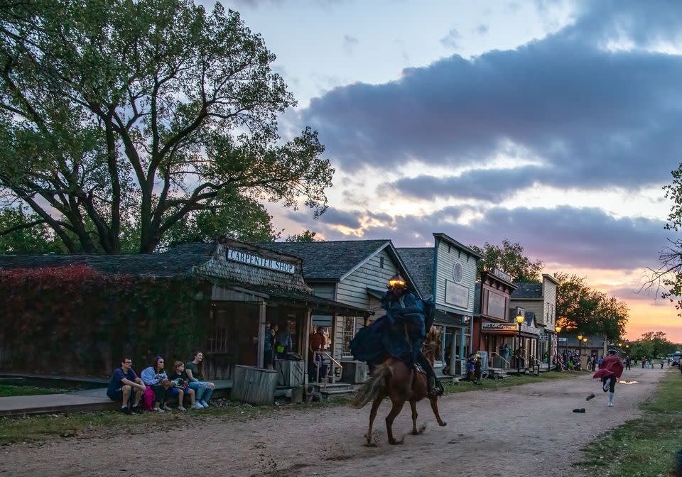Patrons watch a performance during the Hays, Hooves, and Halloween event at Old Cowtown Museum