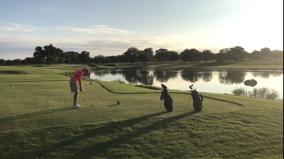 Golfer on Tee at Par 3 16th Hole On Lady Bird Johnson Golf Course In Fredericksburg, TX