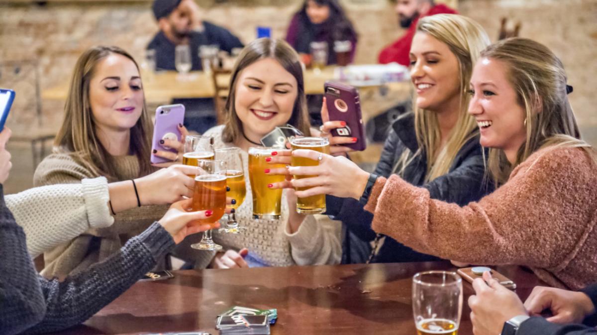 group of people raising a toast