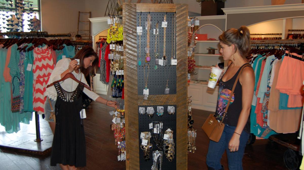 women looking at jewelry for sale