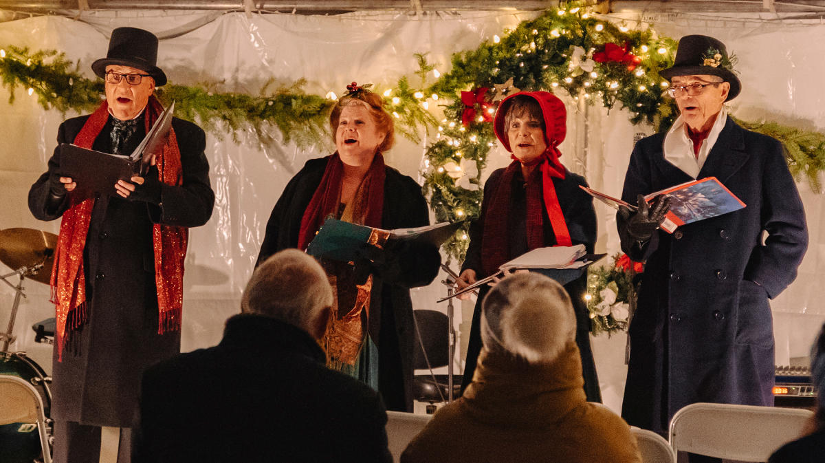 a group of holiday carolers