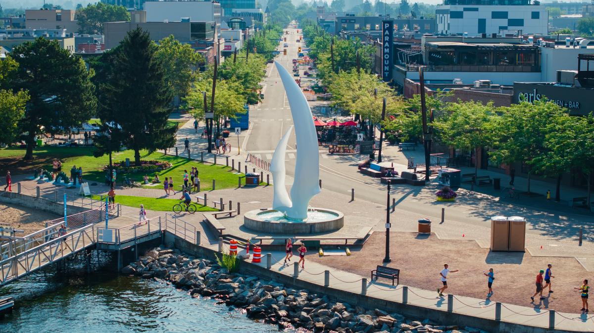 Apple Triathlon 2024 Athletes Running by Sails Sculpture Aerial