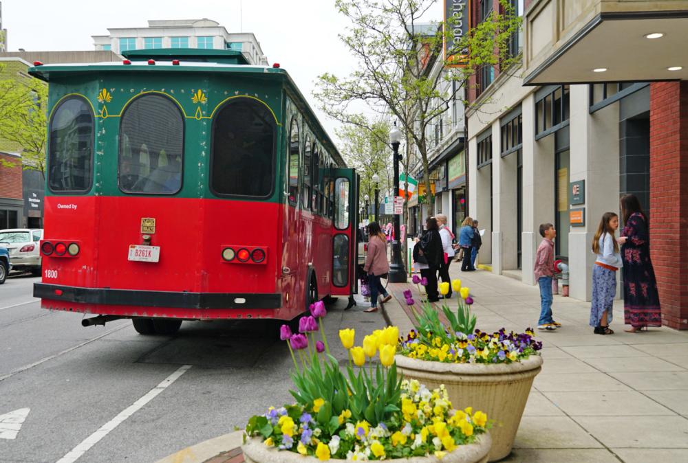 People step onto a trolley while shopping in downtown Fort Wayne.