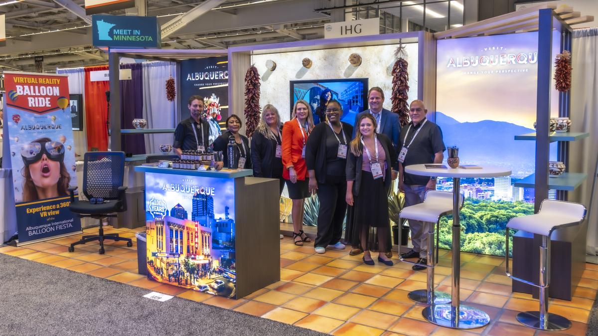 A group shot of the Visit Albuquerque team in the tradeshow booth at the ASAE Annual Meeting