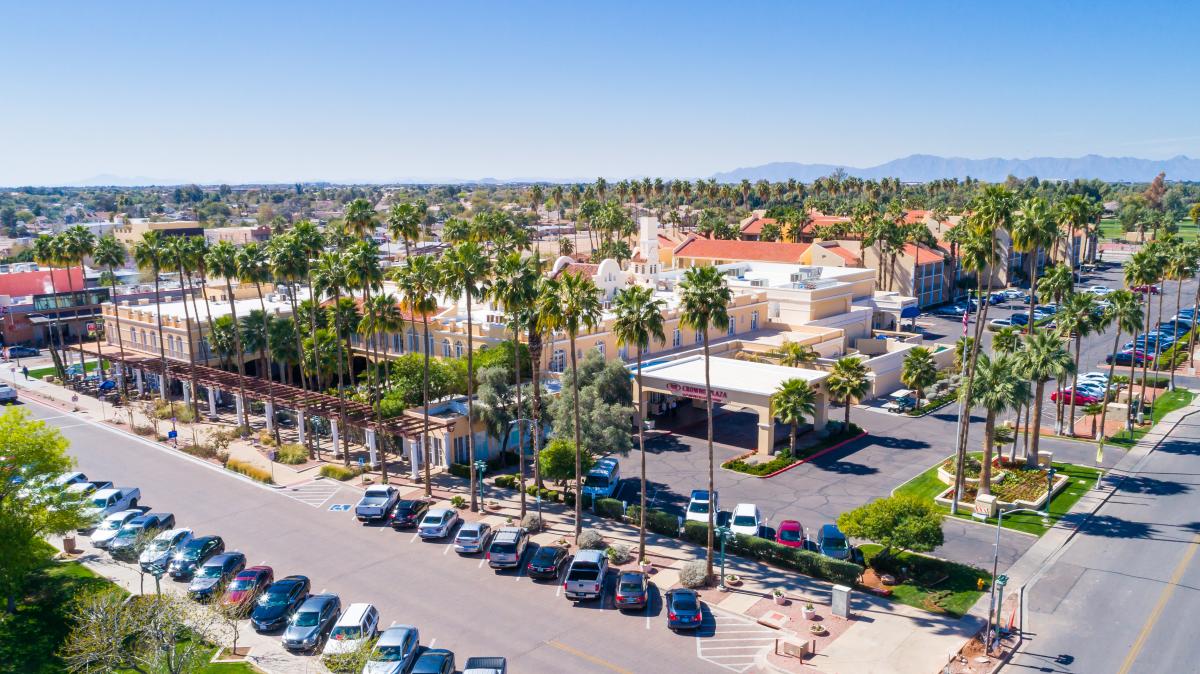 aerial view of downtown chandler showing the buildings, parking and signature palm trees